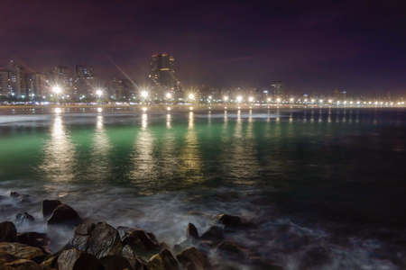 Santos city beach on the coast of the state of Sao Paulo, Brazil, at night.の写真素材
