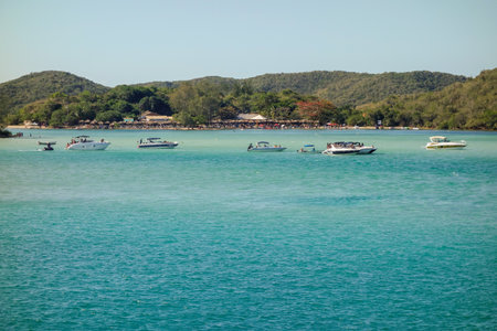 yachts moored at idyllic sea channel on tropical island. Summer vacation and travellingの写真素材