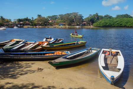 Porto Seguro, Bahia, Brazil: wooden fishing boats moored in Caraiva, coastal and riverside communityのeditorial素材