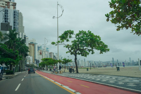main street with bike path in front of the beach in Balneario Camboriu, Santa Catarina, Brazil.の写真素材
