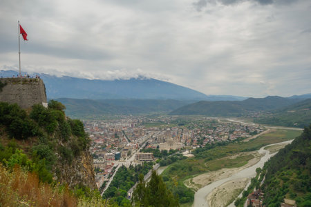 tourists on observation deck of Berat Castle look out over city below. Berat, Albania.
