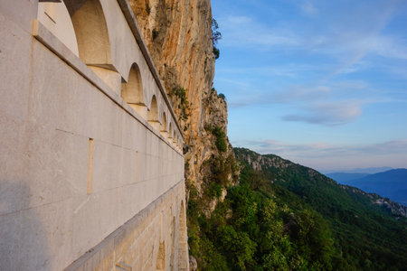 Dabovici, Montenegro - 05.05.2025: Ostrog Monastery, of Serbian Orthodox Church, nestled in rocky hillside.の写真素材