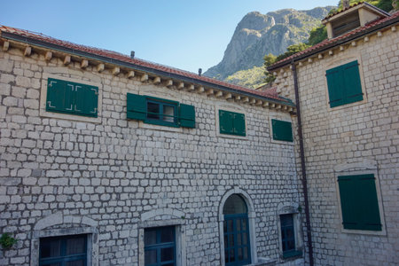 Kotor, Montenegro - 04.29.2025: facades of ancient buildings inside Kotor fort, old town.
