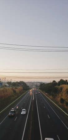 Sunset, landscape, blue sky, horizon, beautiful, good vibe, city, clouds, hidden sun, end of the day, road, speed, cars, highway, Sunset, landscape, blue sky, horizon, beautiful, good vibの写真素材