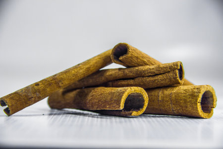 Brown dry raw organic cinnamon roll, spices ingredient, decoration graphic design, closeup food...