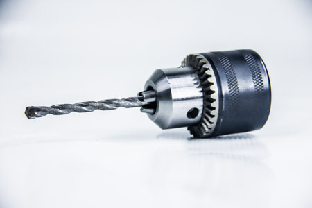 Steel Drill chuck head 13 mm, maintenance electric tools, accessory gear, studio photography shot, isolated on white background, photo is selective focus, shallow depth of field, taken at Cairo Egyptの写真素材