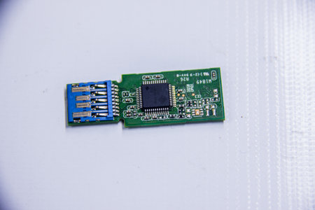 USB circuit board, Macro closeup Green circuit board isolated on white background, electronic...