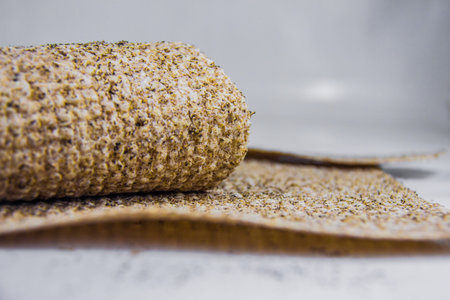 Chia seeds bread, golden yellow bakery food, sandwich roll, heathy digestive meal, bread sheet, studio shot, isolated on white background, selective focus, shallow depth of field, Cairo Egyptの写真素材