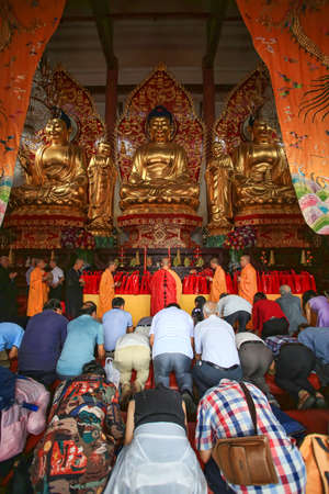 people praying at temple