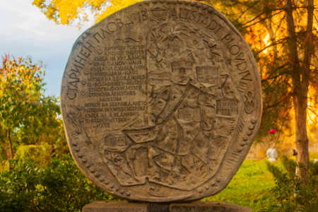 Ancient stone carvings in the park at sunset in autumn.の写真素材