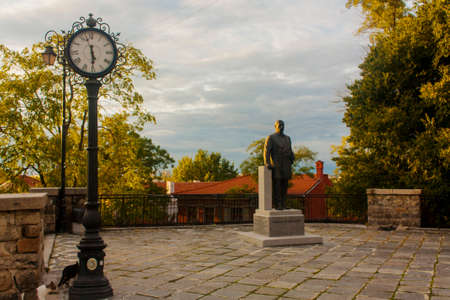 Sculpture of a man with a clock in Szczecin.の写真素材