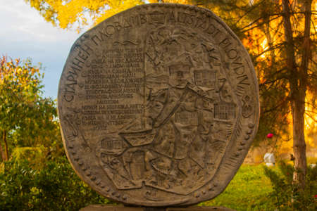 Ancient stone engraving in the park. Selective focus.の写真素材