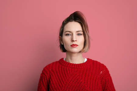 Beautiful young woman wearing casual clothes and smiling posing in the studio.の写真素材