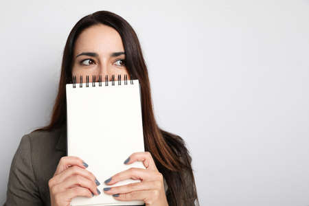 Young business woman working with her notebook in the office.