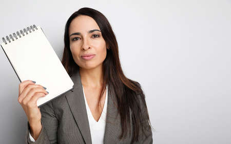 Business woman working in the office with important files and documents. Isolated.