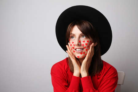 Close-up portrait of young woman celebrating San Valentines Day. Relationship concept.