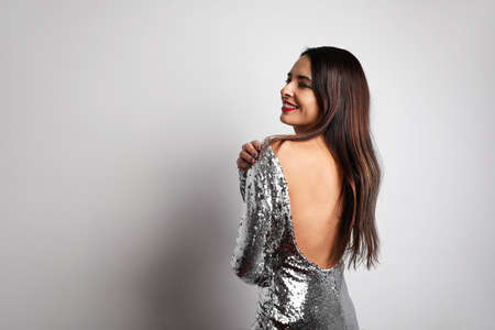 Attractive woman dancing and moving in front of camera. Happy New Year Party.
