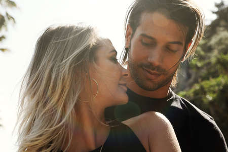 Couple goals. Smiling couple in love outdoors. Horizontal.