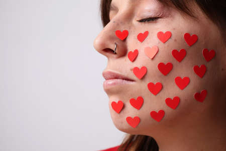 Close-up portrait of young woman celebrating San Valentines Day. Relationship concept.の写真素材