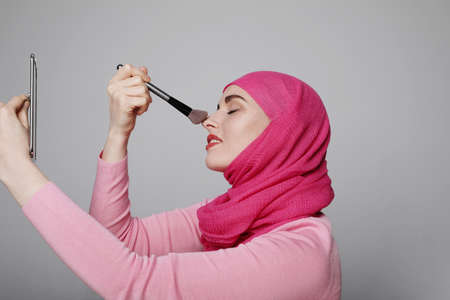Close-up portrait of charming Muslim woman wearing make-up. Horizontal.の写真素材
