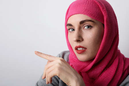 Close-up portrait of a muslim young woman wearing a hijab. Isolated.の写真素材