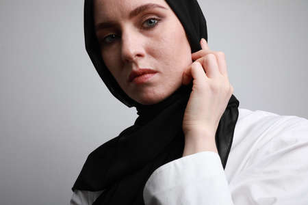 Muslim woman in formal blouse posing for camera. Muslim businesswoman concept. High quality photo.