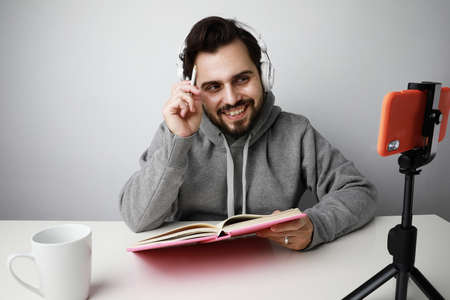 Happy young student doing online conference. Online education.の写真素材