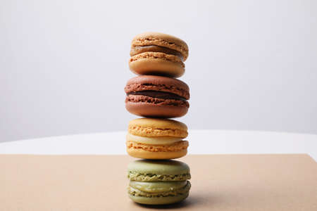 Delicious macarons on craft paper. Sweets and desserts. With copy space.
