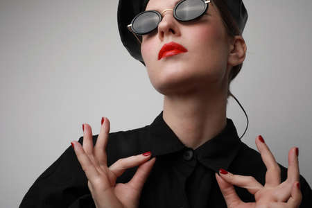 Close-up of trendy woman, wearing fashion clothes. Isolated on white background.