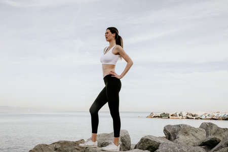 Young and fit sporty woman posing outdoor. Sport and lifestyle.の写真素材