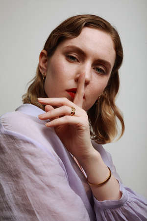 Vertical portrait of caucasian woman looking at the camera. Isolated.