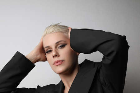 Beauty portrait of fashion blond model with short hair. Studio shot.