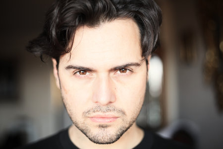 Close-up portrait of a handsome young spanish guy.
