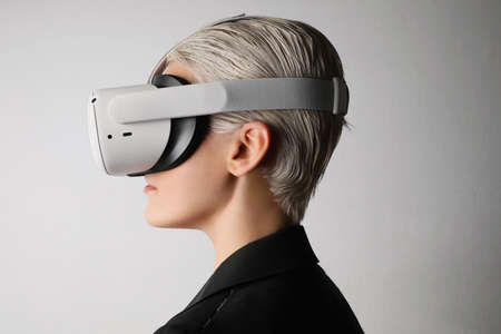 Side portrait of blonde woman with VR glasses. Isolated.