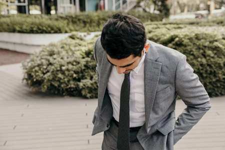 Confident and successful young businessman looking aside. Outdoor.の写真素材