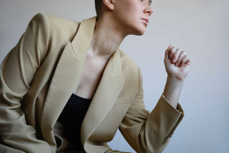 Cropped portrait of beautiful bald woman posing in the studio. Isolated.の写真素材