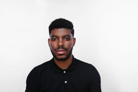 Millennial African American young serious black man looks at the camera.の写真素材