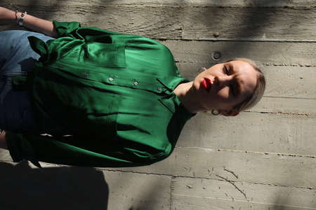 Vertical portrait of young blonde hipster woman, confident and fashionable.の写真素材