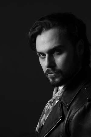 Black and white photo of bearded stylish handsome confident man. Vertical.の写真素材