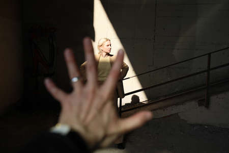 Young woman with blonde hair posing outdoor. Space for text.の写真素材