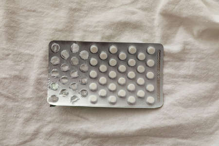 Shot of pills in blister pack on white background. Mock-up.