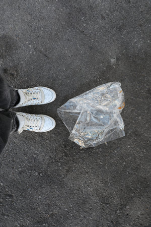 Trash plastic bags on the street. Vertical photo. Top view.の写真素材