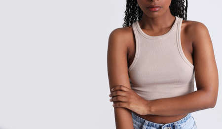 African American young woman caring about her body. Body positive concept.の写真素材