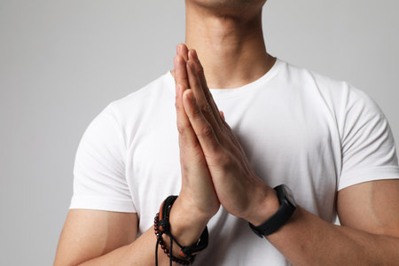 Cropped portrait of young man posing on white wall. Mindset concept. Mock-up.の写真素材