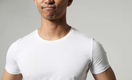 Cropped shot of handsome man posing on white wall. Mindset concept. Mock-up.
