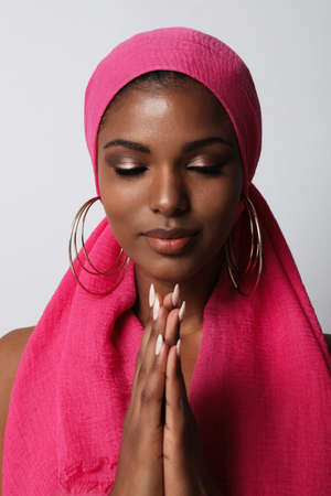 Vertical shot of gorgeous African American woman wears traditional turban.の写真素材