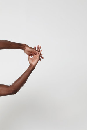 Rear view of healthy young man with arms stretched out.の写真素材