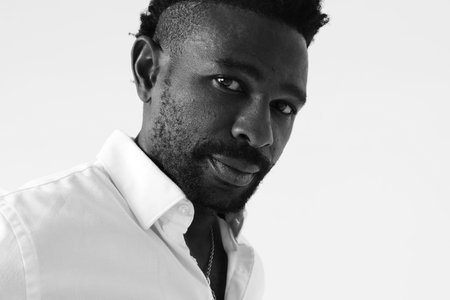 Serious young man wears casual outfit. Good emotions concept. Black and white.の写真素材