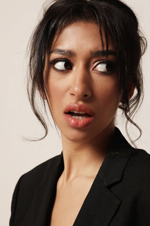 Vertical portrait of young surprised arab woman. Thinking positive. Mind set.