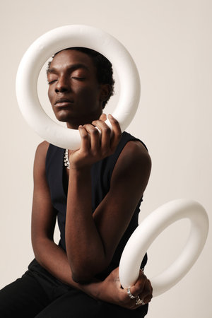 Time is a circle. Confident young man looking at the camera. Vertical mock-up.の写真素材
